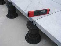 Bison Versadjust adjustable pedestal supports elevated natural stone paver